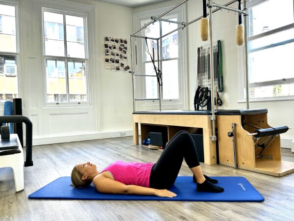 Pilates Bridge Exercise for a Stronger Back and Glutes - Complete