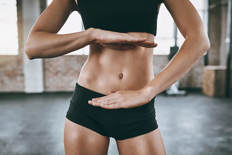 Pilates Principles - Centre - A female body focused on the abdomen