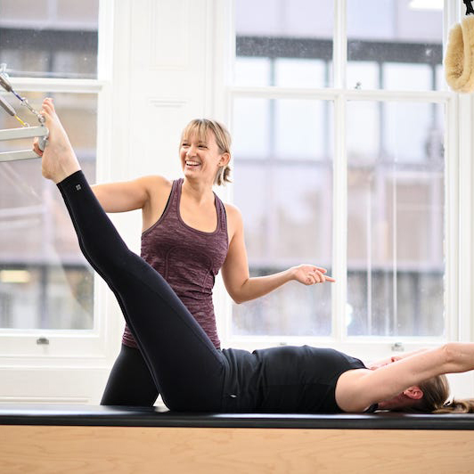 Parakeet prep Roll down on the trapeze table a great exercise for Pilates beginners