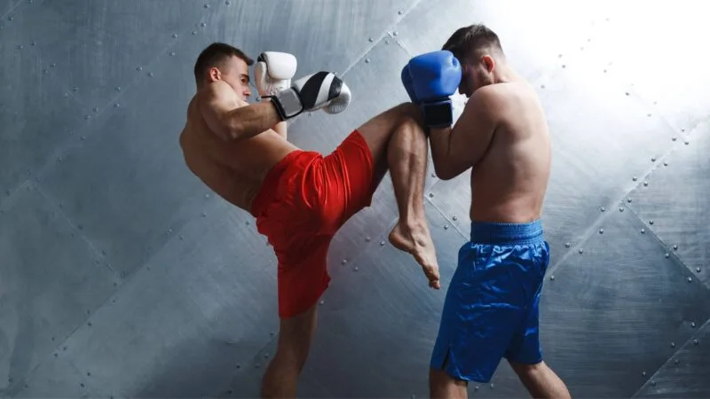 two men fighting in muay thai style Complete Pilates
