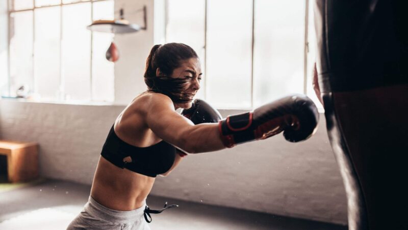 women punching a training bag Complete Pilates