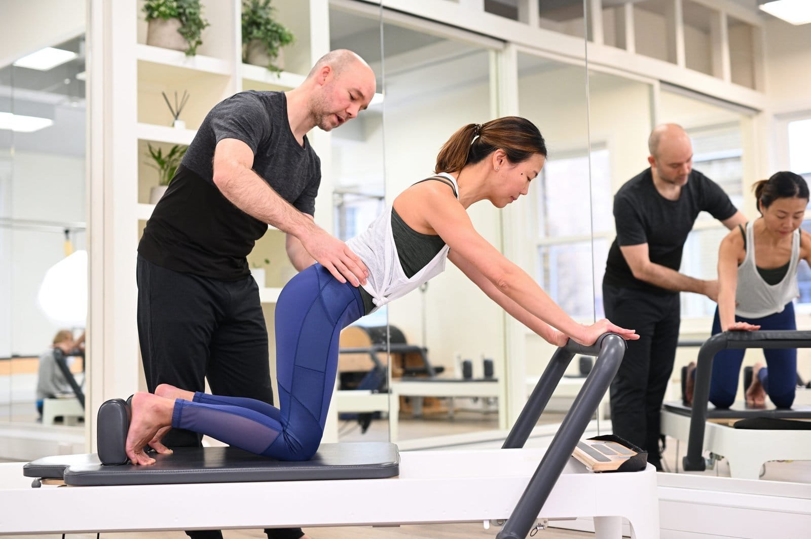 Group Reformer Pilates class in London